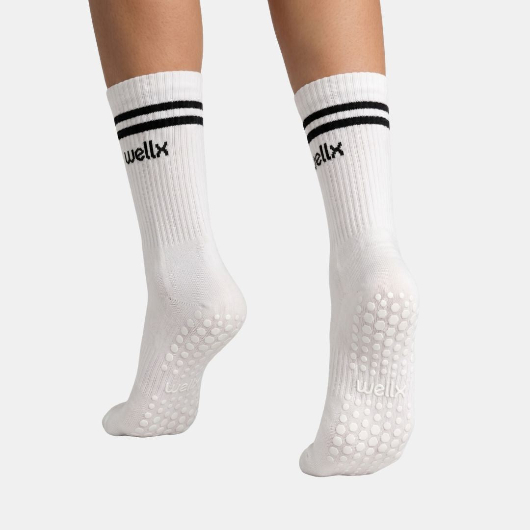 Calcetines deportivos con agarre de balance de blancos