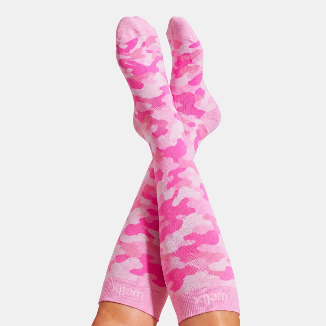 Camouflage Pink Compression Socks For Women, Pink camouflage crew socks worn on legs, shown against a light gray background. The brand name 'klem' is visible on the ribbed cuffs.