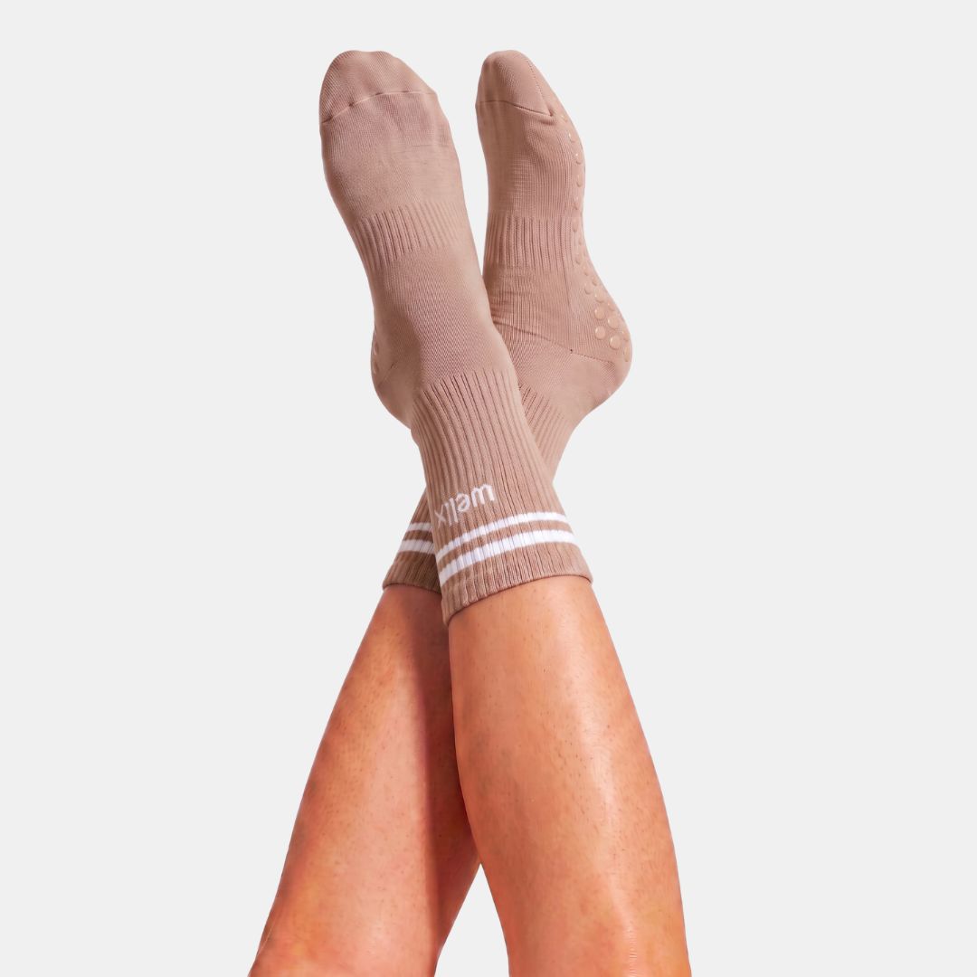 Gravel Balance Grip Socks For Men with non-slip grip sole, ribbed knit and white double-stripe cuff, soles facing camera