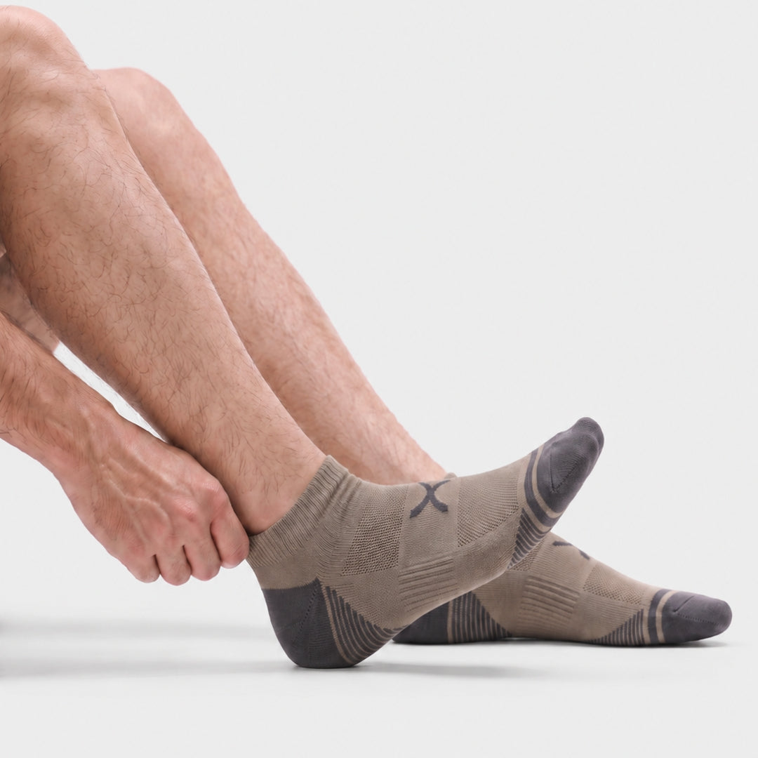 Gravel Power Stride Ankle Socks For Men with charcoal toe and heel, breathable mesh knit and arch support, shown from the side